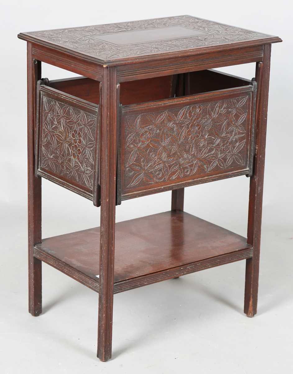 A late Victorian Aesthetic Movement mahogany tea table, fitted with a drop-leaf section to each