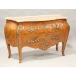 A 20th century French kingwood and floral marquetry two-drawer commode of bombé form, the shaped