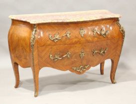A 20th century French kingwood and floral marquetry two-drawer commode of bombé form, the shaped