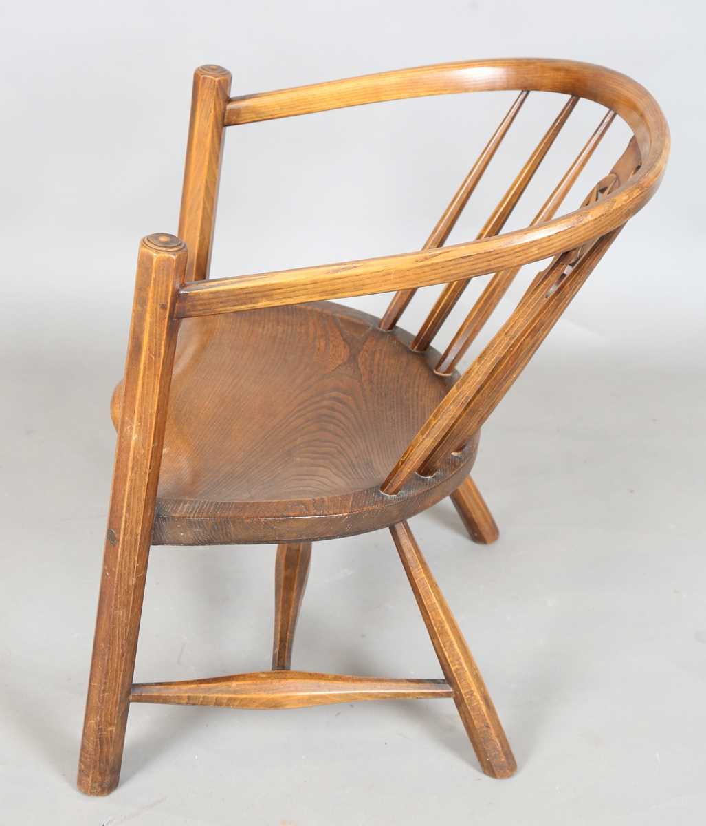 An early 20th century Arts and Crafts ash and elm tub back armchair with a pierced star splat - Image 8 of 9