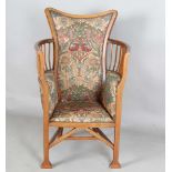 An Edwardian Arts and Crafts mahogany framed armchair, in the manner of G.M. Ellwood and possibly