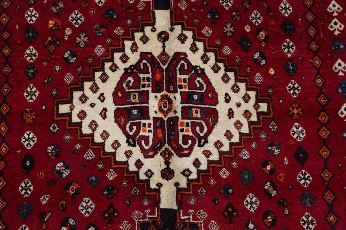A Ghashghai rug, South-west Persia, late 20th century, the red field with three linked medallions, - Image 5 of 7