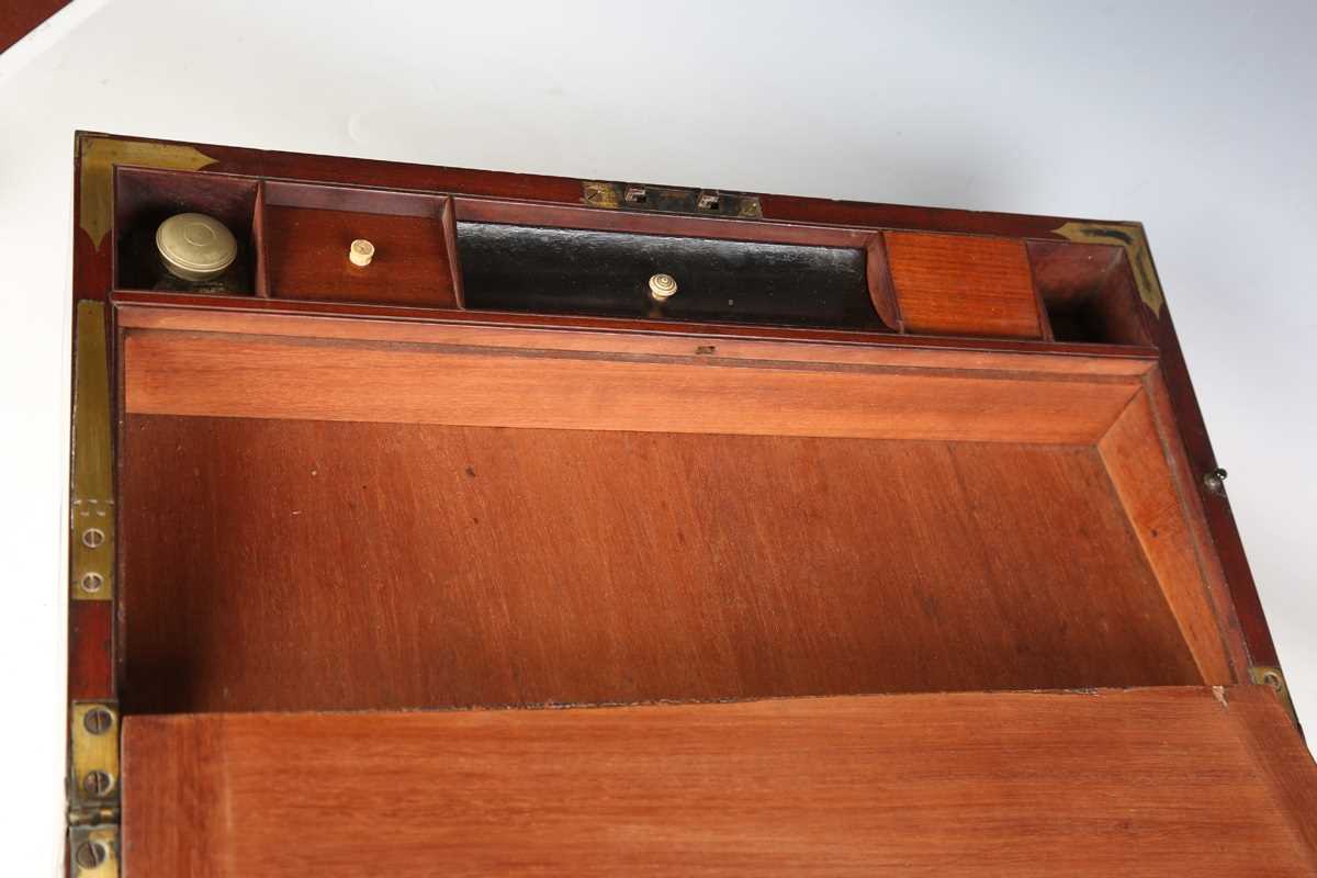 A late George III mahogany and gilt brass bound campaign style writing slope, the sides with brass - Image 7 of 15