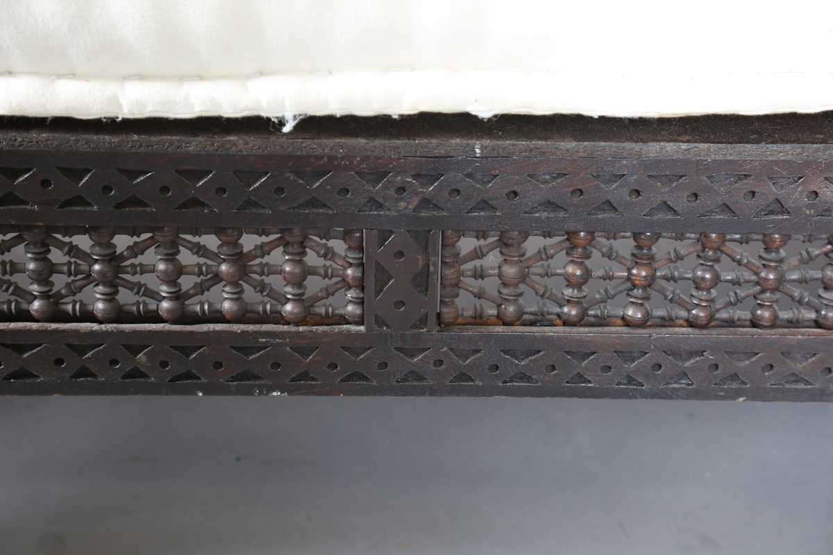 An early 20th century Middle Eastern softwood daybed, similar to those retailed by Liberty & Co, - Image 6 of 15