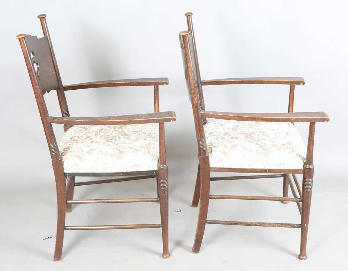 A pair of early 20th century Arts and Crafts oak and ash framed elbow chairs, in the manner of - Image 9 of 12