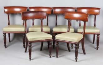 A set of six William IV mahogany bar back dining chairs with tulip cusp and reeded tapering legs,