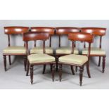 A set of six William IV mahogany bar back dining chairs with tulip cusp and reeded tapering legs,