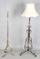 An early 20th century Arts and Crafts brass lamp standard, on splayed tripod legs, height 144cm,