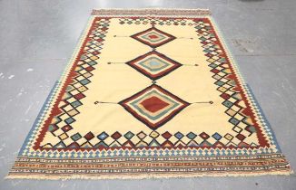 A Ghashghai kelhim carpet, South-west Persia, late 20th century, the sand-coloured field with a