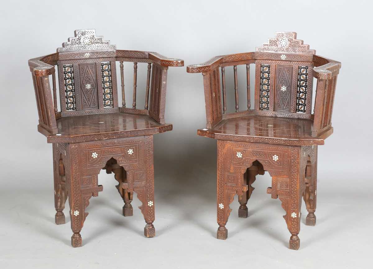 A pair of late 19th/early 20th century Middle Eastern hardwood and mother-of-pearl inlaid tub back