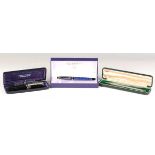 A Waterman blue cased fountain pen, boxed, two Sheaffer fountain pens and a silver propelling pencil