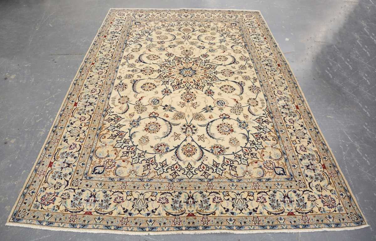 A Nain carpet, Central Persia, late 20th century, the cream field with a flowerhead medallion and