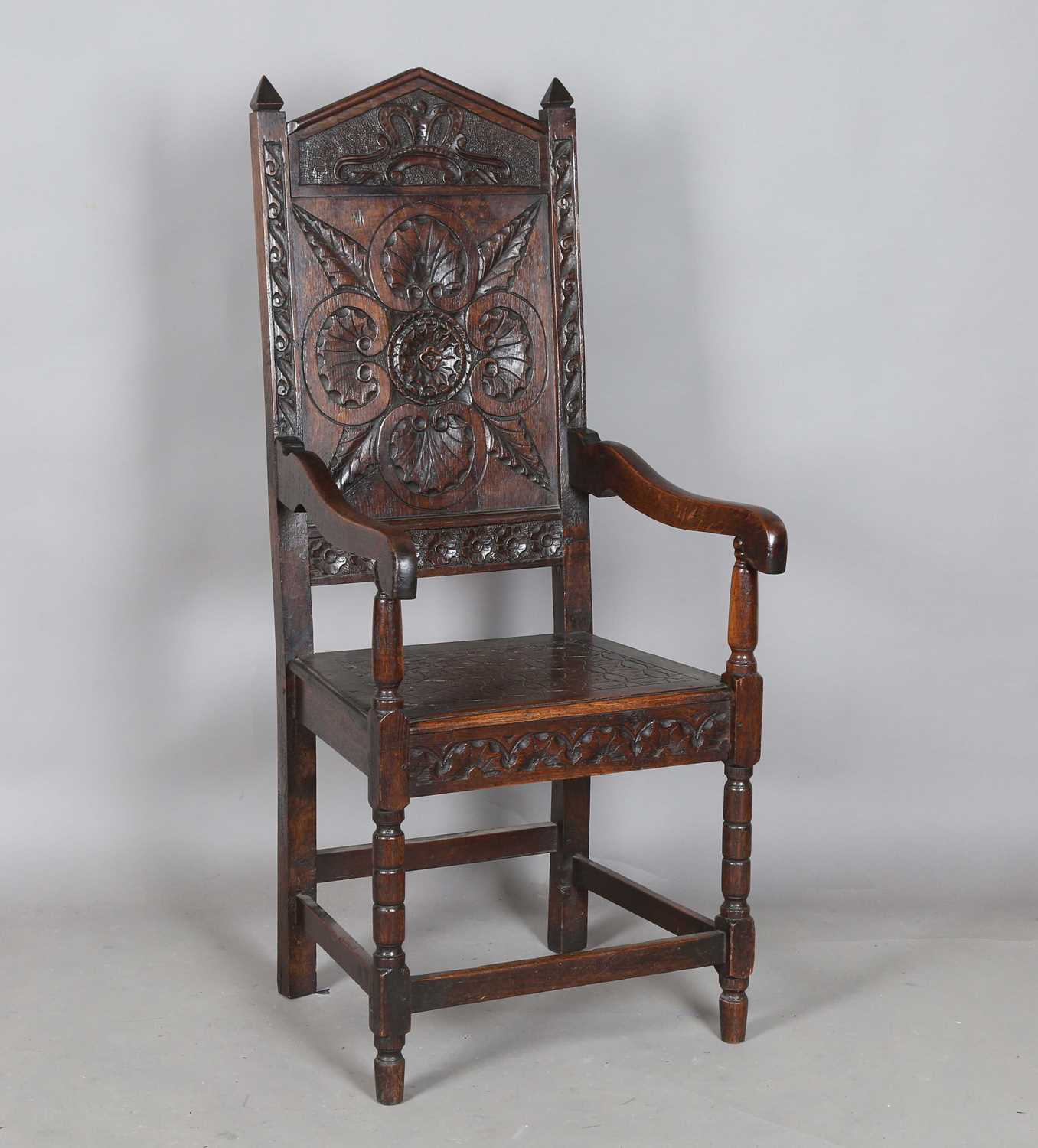 A late 19th/early 20th century Carolean Revival oak Wainscot armchair, height 115cm, width 51cm,