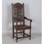 A late 19th/early 20th century Carolean Revival oak Wainscot armchair, height 115cm, width 51cm,