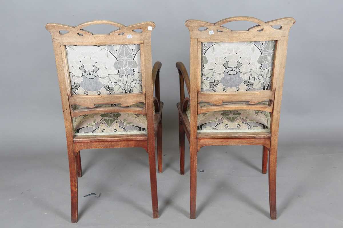 An Art Nouveau stained beech three-piece salon suite with pierced showframe and contemporary fabric, - Image 25 of 27