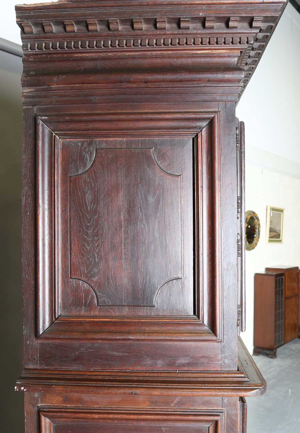 A large 18th century Continental oak cupboard, fitted with four panelled doors and two drawers, - Image 10 of 17