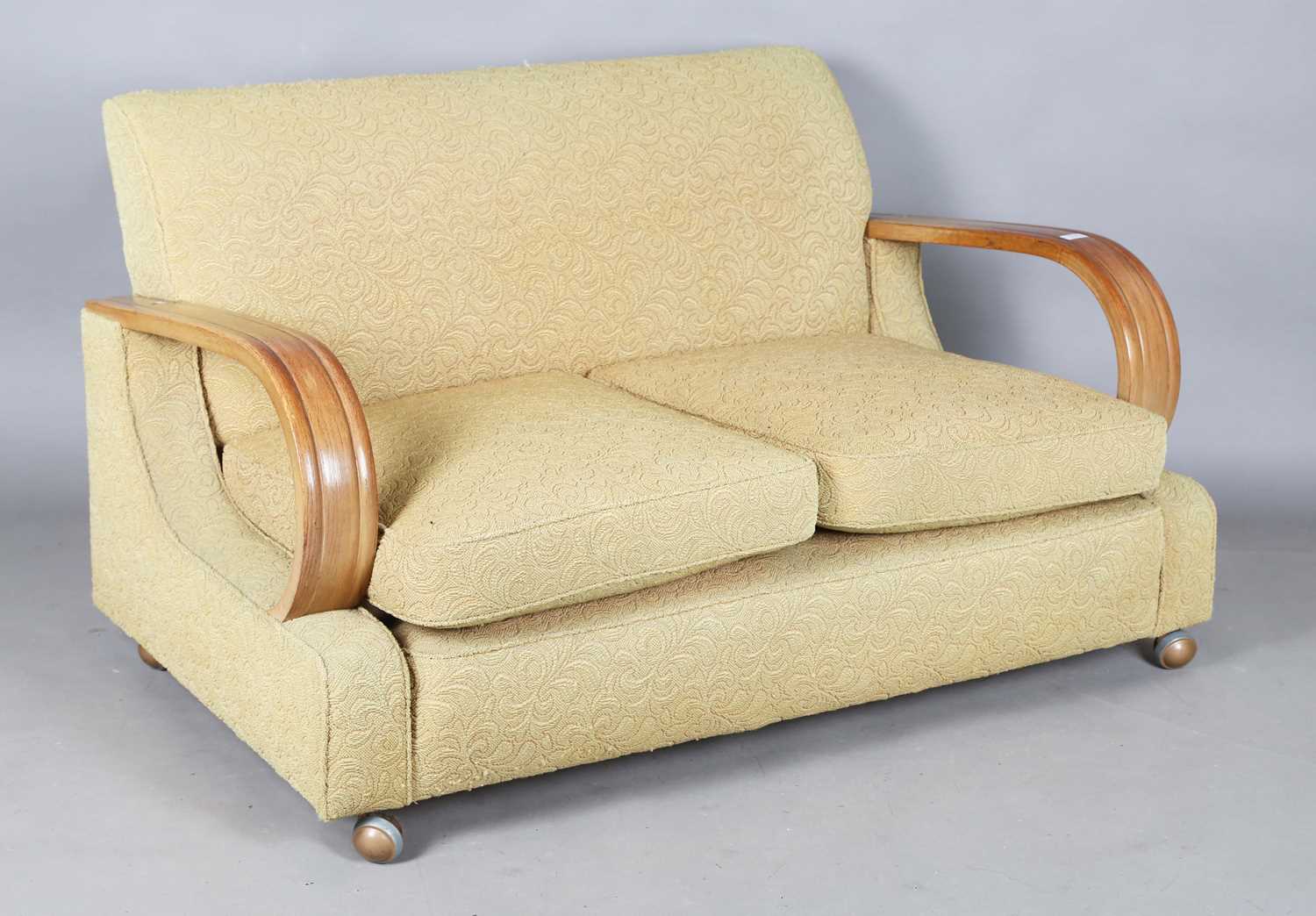 An Art Deco three-piece suite, possibly by Heals & Son, the angular backs flanked by substantial