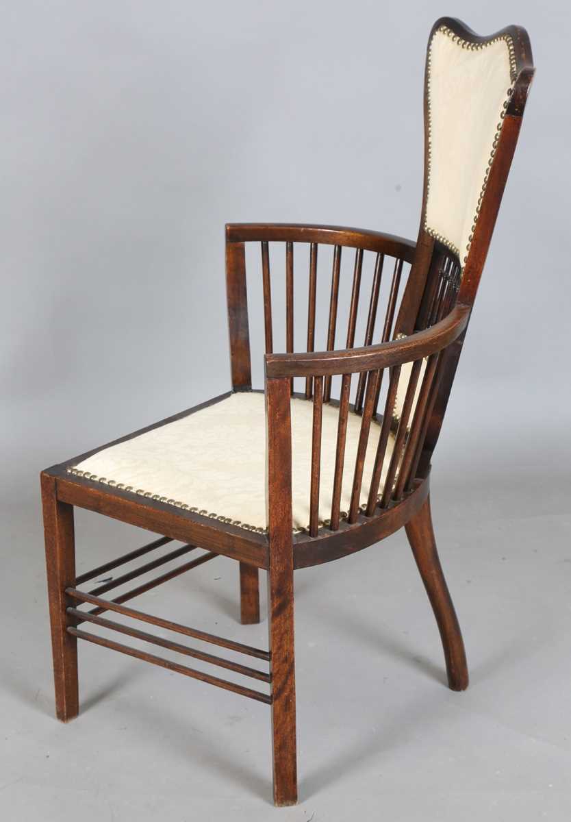 An Edwardian Arts and Crafts style stained walnut showframe armchair, upholstered in cream fabric, - Image 16 of 17