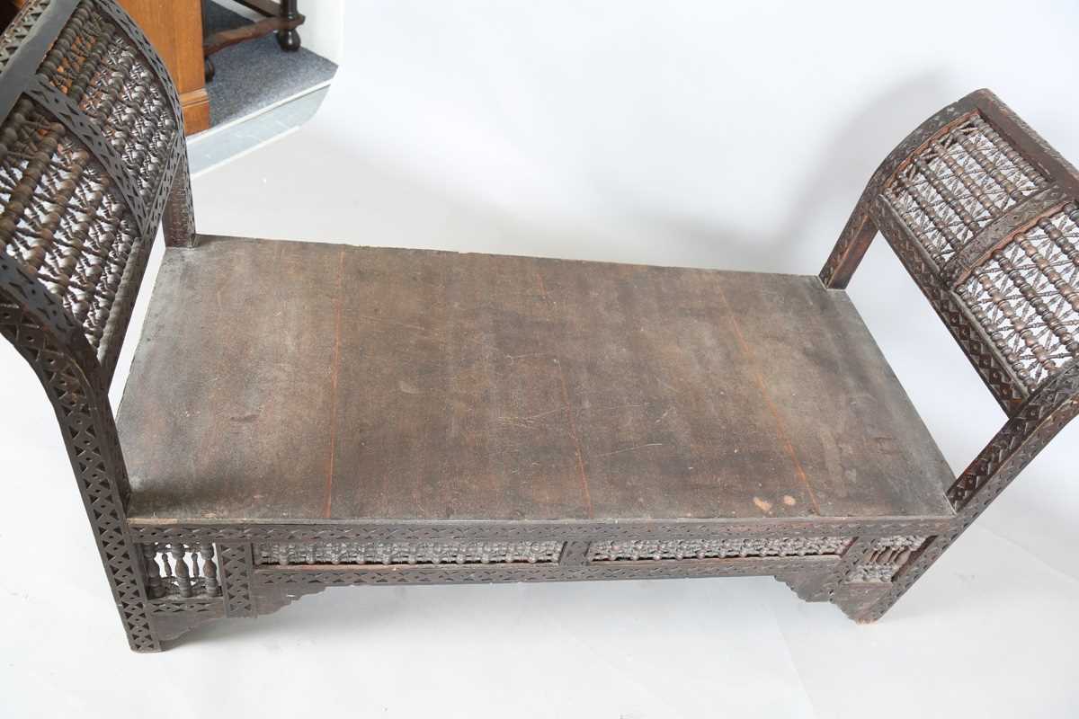 An early 20th century Middle Eastern softwood daybed, similar to those retailed by Liberty & Co, - Image 12 of 15