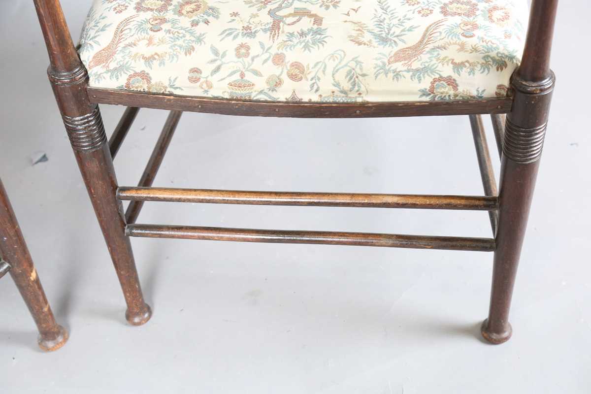 A pair of early 20th century Arts and Crafts oak and ash framed elbow chairs, in the manner of - Image 8 of 12