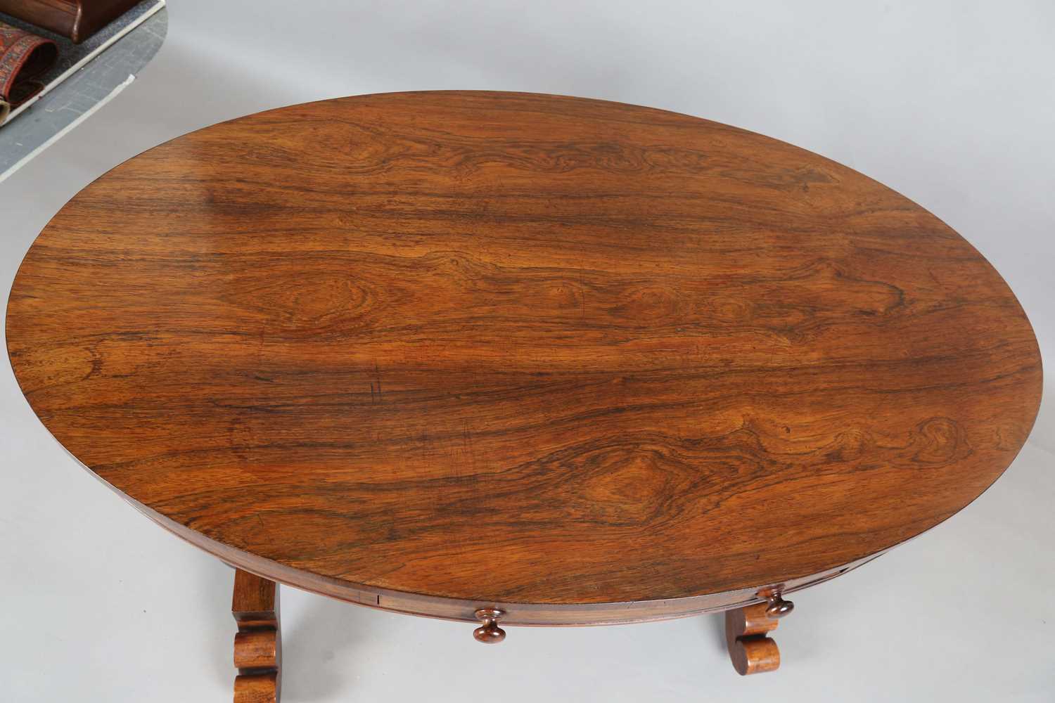 An early Victorian rosewood oval library table, fitted with opposing drawers, on octagonal - Image 2 of 10