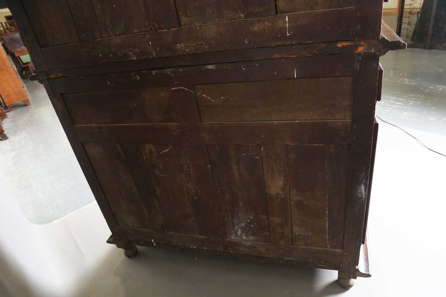 A large 18th century Continental oak cupboard, fitted with four panelled doors and two drawers, - Image 14 of 17