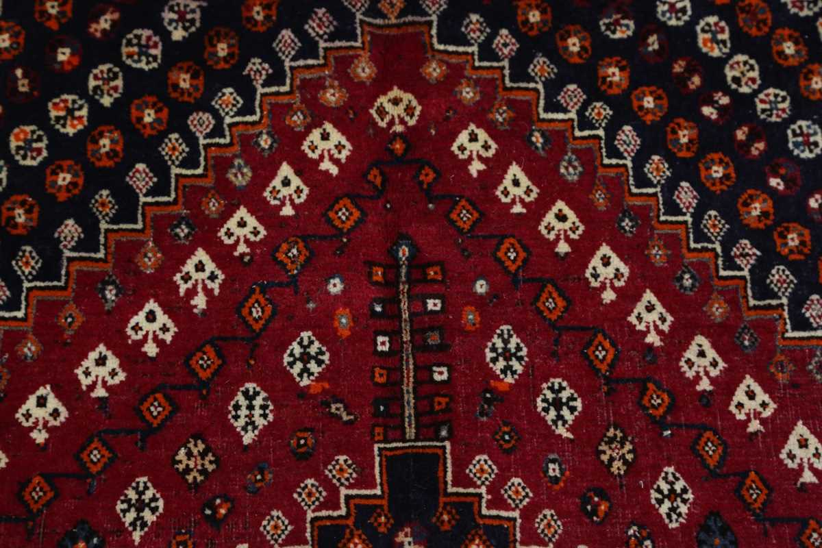 A Ghashghai rug, South-west Persia, late 20th century, the red field with three linked medallions, - Image 3 of 7