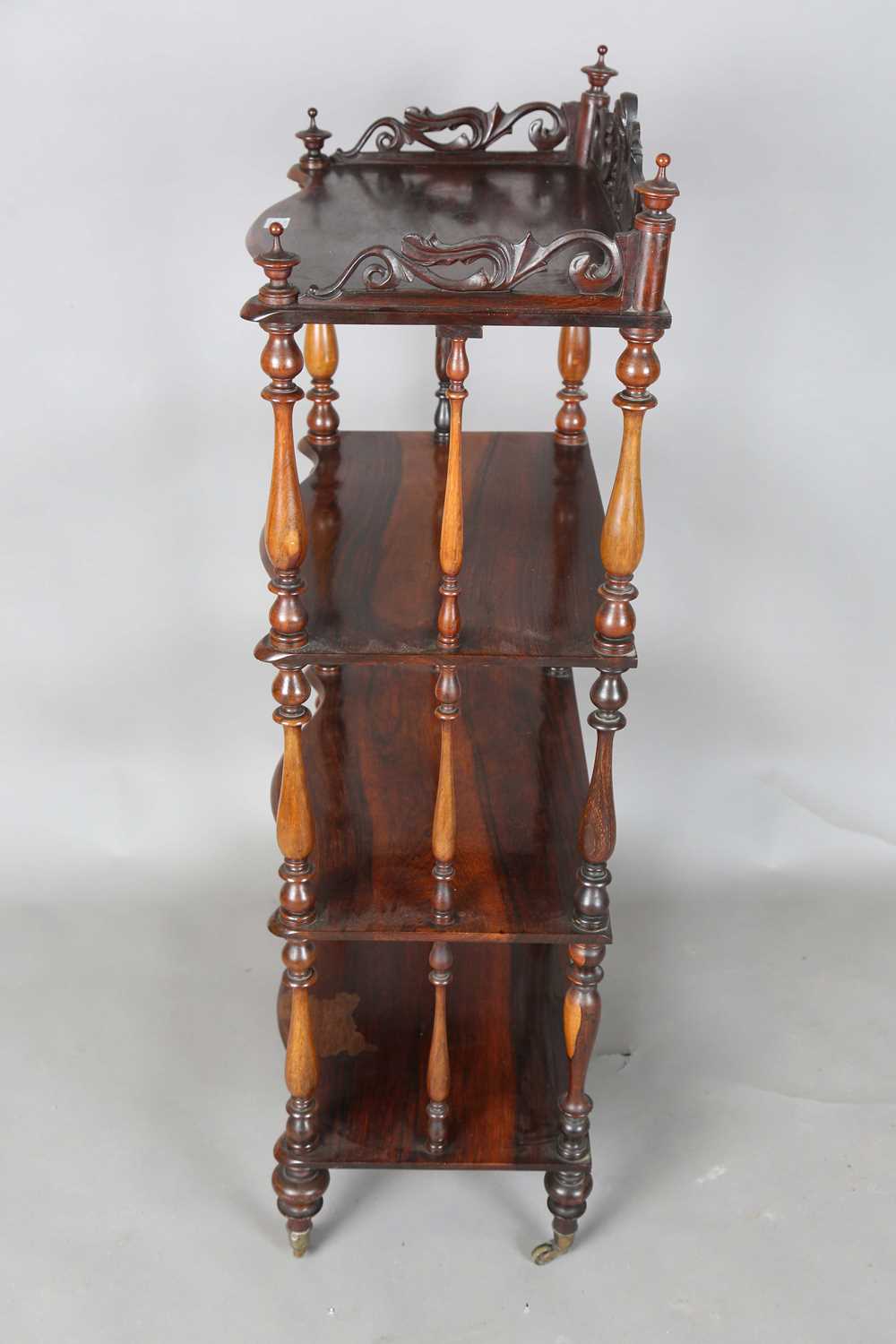 A Victorian rosewood serpentine-fronted four-tier whatnot, height 125cm, width 56cm, depth 36cm. - Image 12 of 12