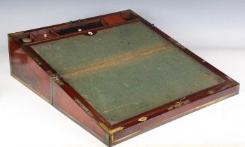 A late George III mahogany and gilt brass bound campaign style writing slope, the sides with brass