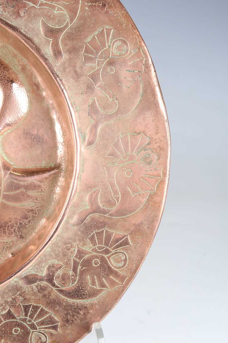 A Newlyn style copper circular charger, worked with a central galleon within a border of fish, - Image 5 of 7