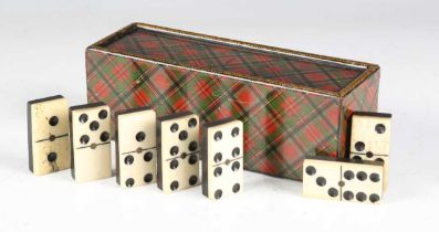 A Victorian 'Prince Charlie' Tartanware dominoes box, the sliding lid revealing a set of bone and