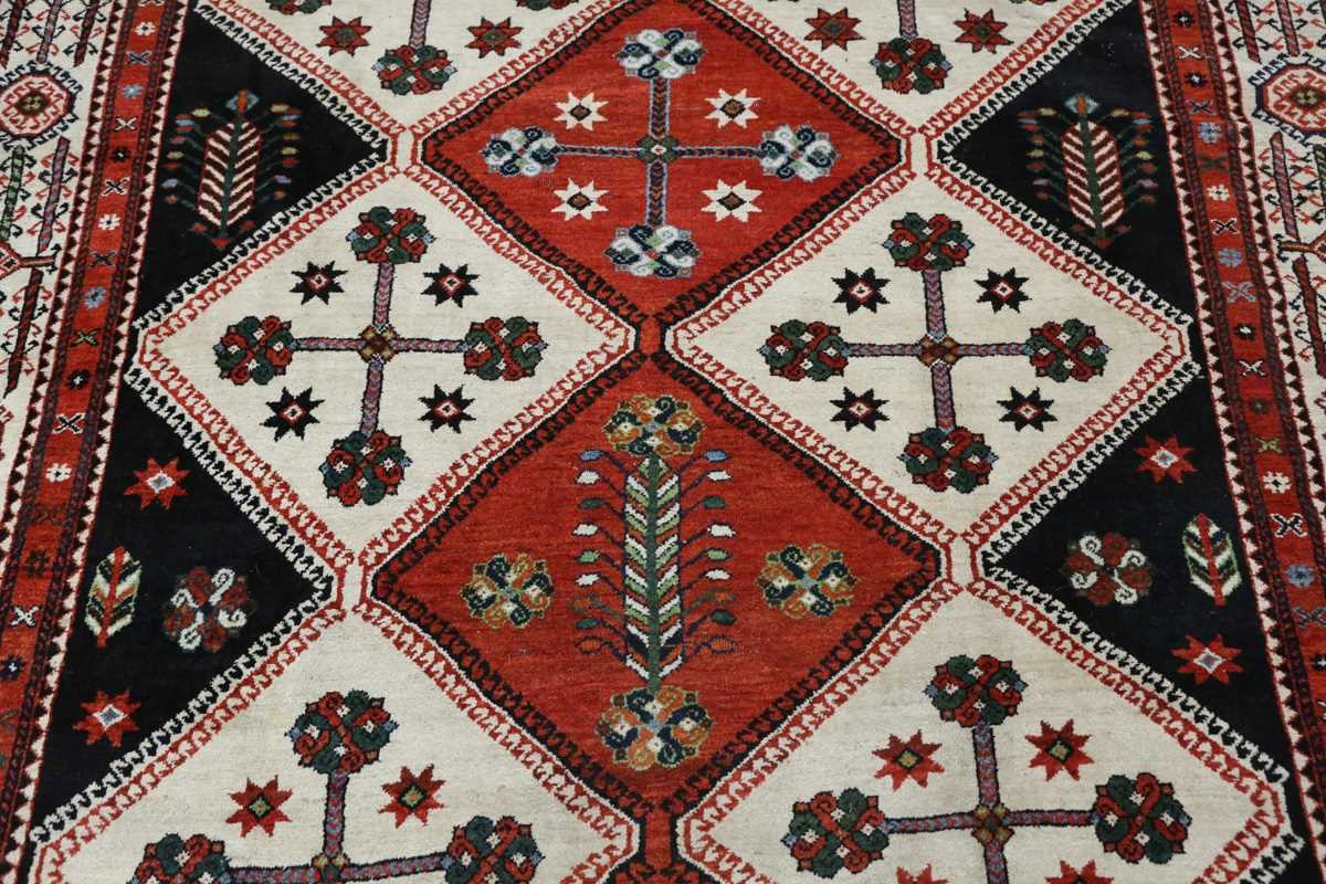 A Luri carpet, South-west Persia, early 20th century, the compartmentalized field enclosing stylized - Image 4 of 9