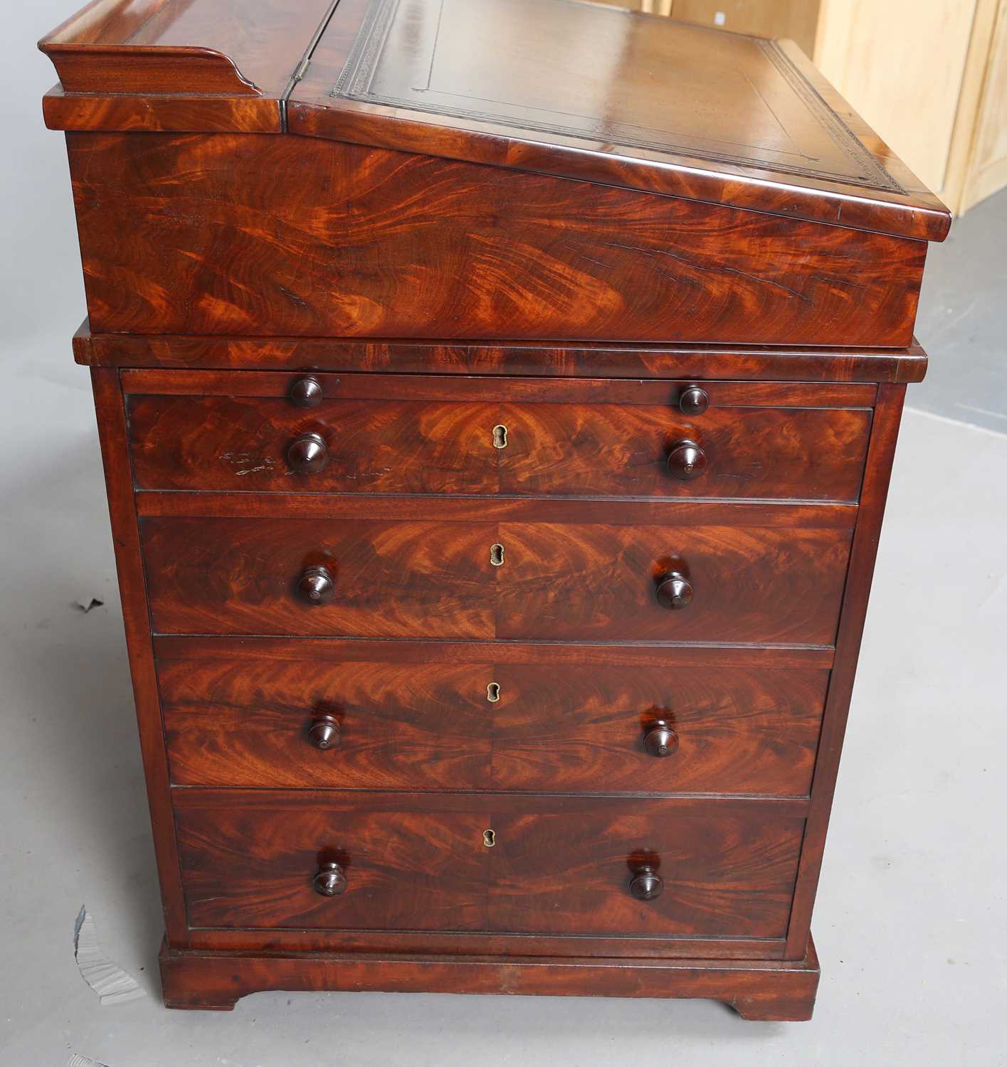 A good early Victorian flame mahogany Davenport, the hinged writing slope inset with tooled - Image 8 of 12