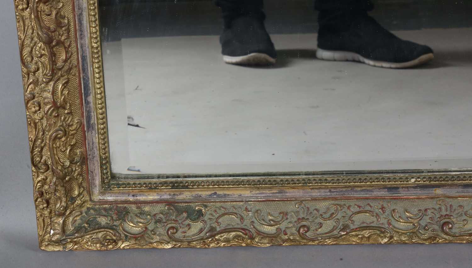 A late 19th century gilt composition arched overmantel mirror with a foliate scroll surmount and - Image 9 of 15