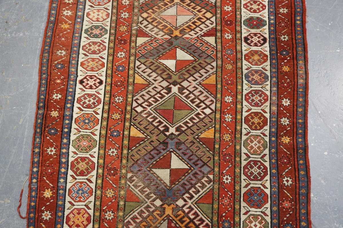 A Kazak runner, Caucasus, early 20th century, the polychrome field with a column of hooked - Image 4 of 6