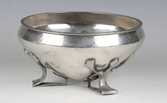 A Liberty & Co 'Tudric' pewter circular bowl, model number '01128', the hammered body raised on