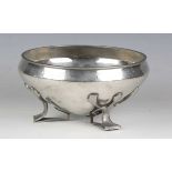 A Liberty & Co 'Tudric' pewter circular bowl, model number '01128', the hammered body raised on