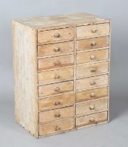 A 19th century pine bank of sixteen drawers, height 62cm, width 48cm, depth 30cm. Provenance: from