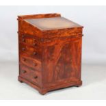 A good early Victorian flame mahogany Davenport, the hinged writing slope inset with tooled