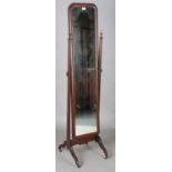 An early 20th century mahogany cheval mirror, on fluted supports, height 166cm, width 41cm.