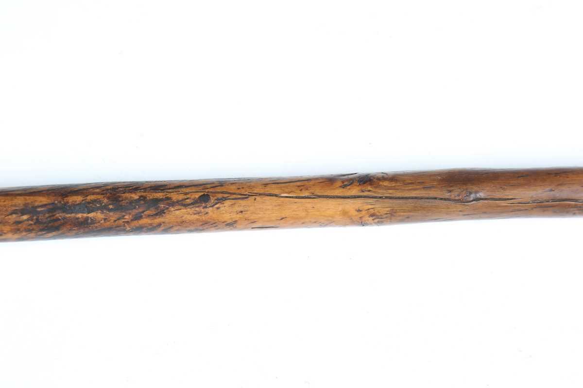 A 19th century patinated treen distaff, probably Greek, the shaped crosspiece finely incised with - Image 10 of 12