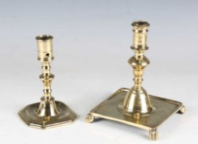 A late 17th/early 18th century brass candlestick, probably English, on a canted square base,