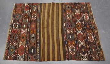 A Turkish flatweave saddle bag, late 20th century, worked with bands of hooked guls, 140cm x