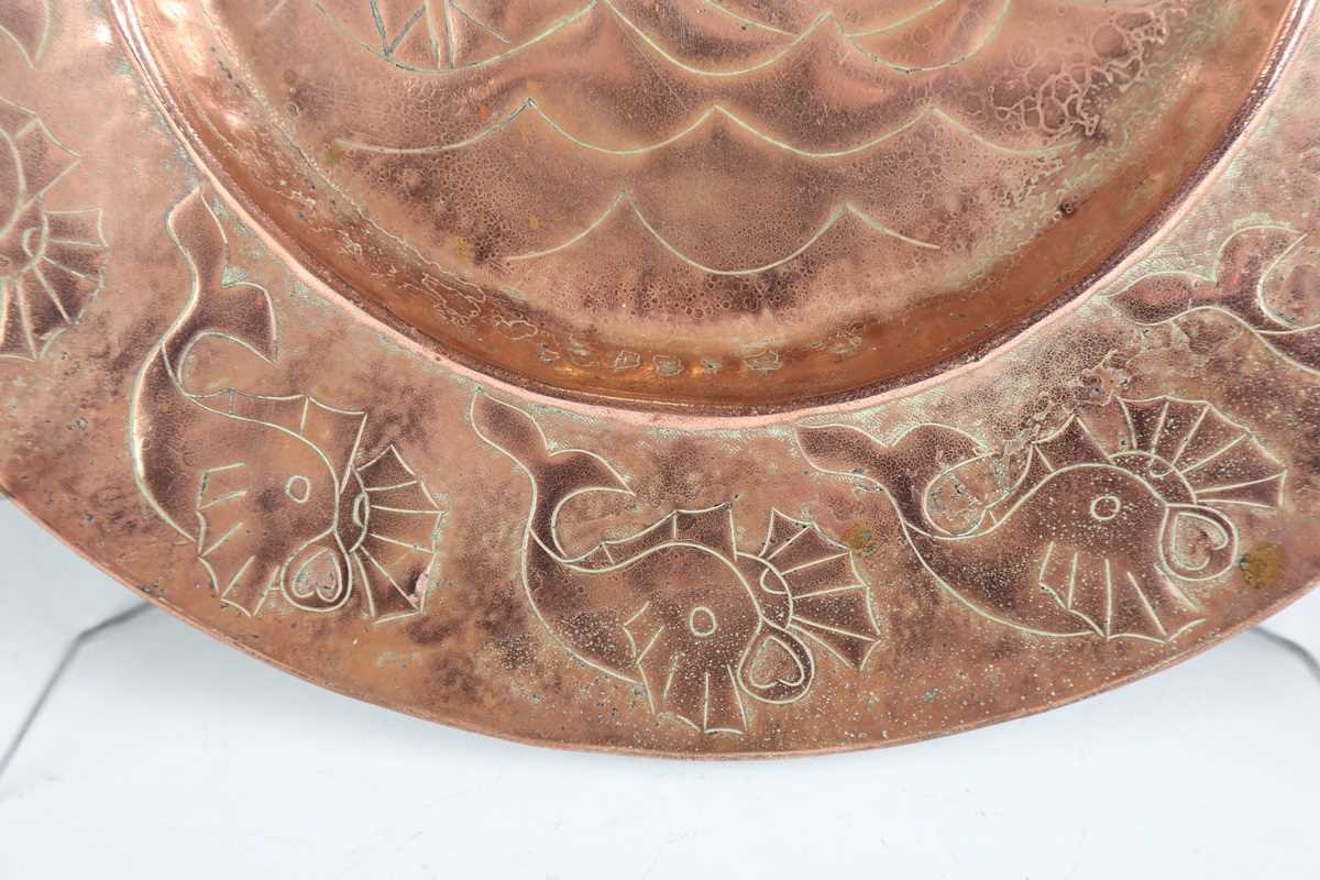 A Newlyn style copper circular charger, worked with a central galleon within a border of fish, - Image 4 of 7