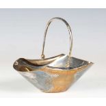 A late Victorian Aesthetic Movement plated basket, designed by Dr Christopher Dresser for Hukin &