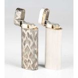 A Cartier pocket lighter with textured case, length 7cm, and another Cartier lighter with machined