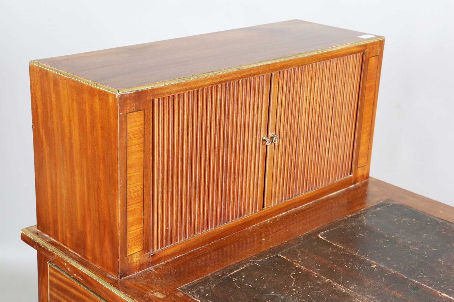 An early 20th century French mahogany and brass mounted bureau plat with raised tambour compartment, - Image 2 of 19