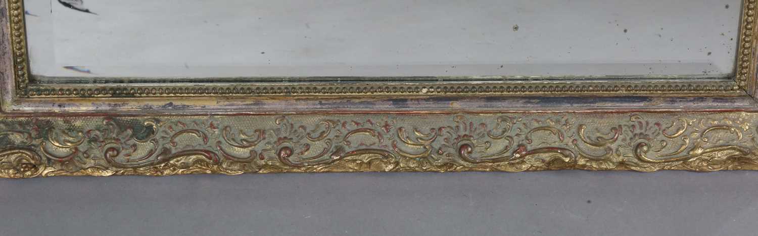 A late 19th century gilt composition arched overmantel mirror with a foliate scroll surmount and - Image 8 of 15