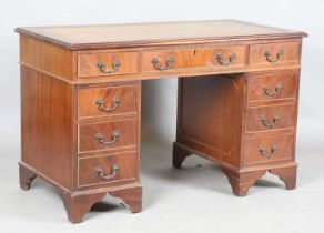 A late 20th century reproduction mahogany twin pedestal desk, height 76cm, width 122cm, depth 61cm.