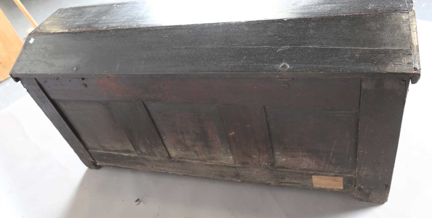 An 18th century panelled oak coffer with a domed lid and carved front, height 61cm, width 125cm, - Image 10 of 12